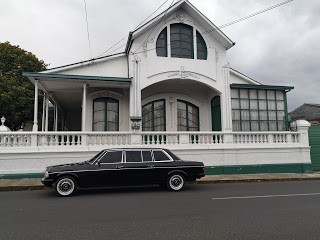 GREEN AND WHITE MANSION. CARTAGO COSTA RICA MERCEDES LIMOUSINE TRANSPORTATION